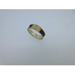 A 19th century love token ring with hairwork, the yellow metal band, tests for 14/15ct gold, holding