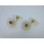 A pair of chalcedony and emerald cufflinks, each with one end designed as a cushion shape of white