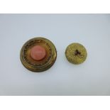 Two circular Victorian gem set brooches - one coral, one with a garnet and diamond flower, the first