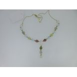 A multi gemset pendant necklace, designed as a line of pearshaped cabochon hardstones including