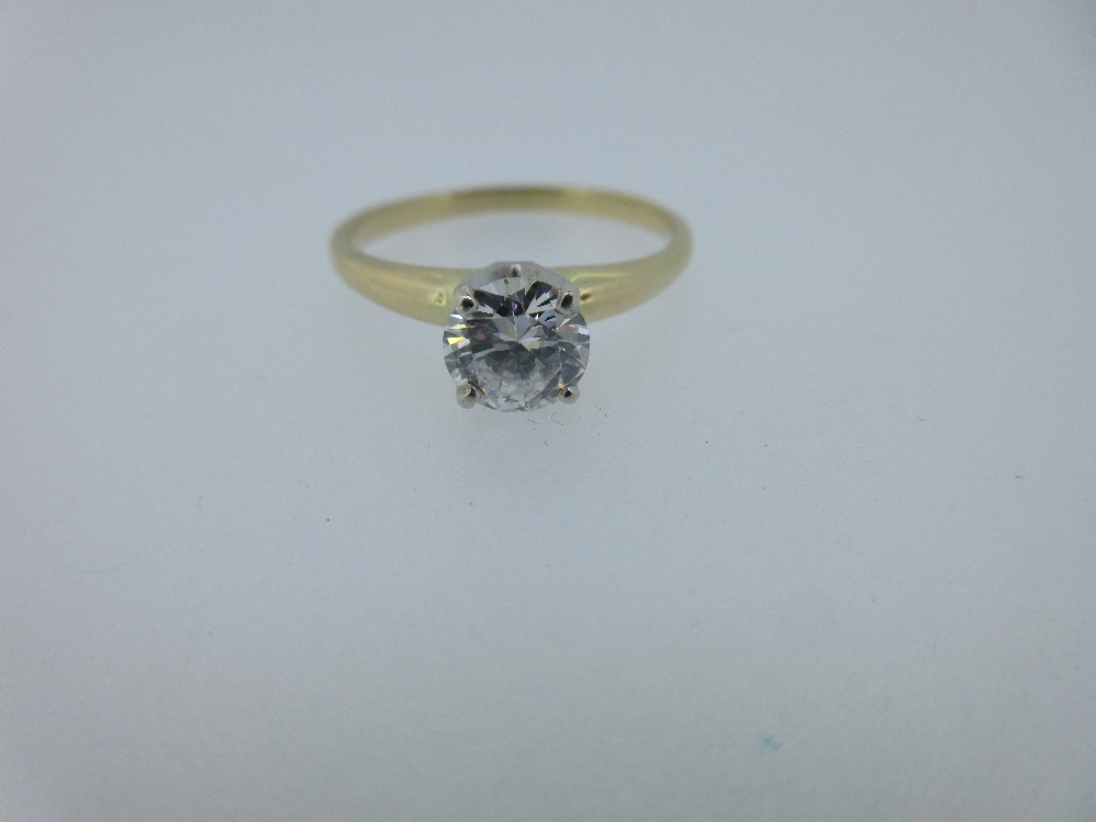 A single stone diamond ring, the round brilliant cut diamond, estimated weight 0.80ct, in a four - Image 3 of 4