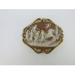 A Victorian cameo brooch depicting Helios chasing the dawn, the shell cameo finely and deeply carved