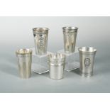 A collection of five Swiss metalwares tumblers, of conical form with applied wording relating to