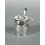 A George III silver barrel shaped mustard and spoon, by Michael Plummer, London 1795, with reed