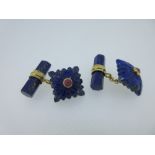 A pair of lapis lazuli and ruby cufflinks, each with one end designed as a square, slightly domed