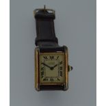 Cartier - A vermeil 'Les must de Cartier' 'Tank' wristwatch, circa 1990, the signed rectangular
