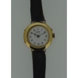 Longines - A lady's 9ct gold wristwatch, circa 1912, the circular signed white enamel dial, 20mm