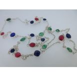 A three-coloured gem set chain necklace, the belcher link chain punctuated at short intervals with