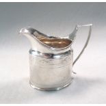 A George III silver cream jug, maker's mark indistinct, London 1803, of oval form, with reeded