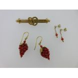 A pair of coral earpendants formed as bunches of grapes, together with a Victorian brooch and