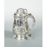 A George III silver lidded tankard with later decoration, by John Payne, London 1763, of baluster