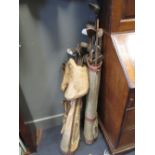 Two sets of old golf clubs