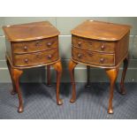 A pair of bow front mahogany two drawer side tables, on cabriole legs (2)