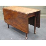 A 19th century mahogany drop leaf dining table