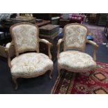 A pair of French beechwood framed armchairs (2)