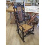 A walnut high back armchair on later rockers