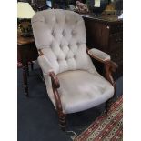 A Victorian walnut button back armchair