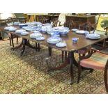 A mahogany twin pedestal dining table with two leaves h74cm w274cm l122cm approx extended