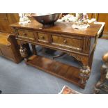 An oak dresser in the Tudor style 84cm 130cm 36cm