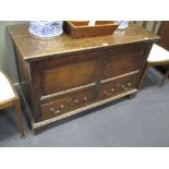 An 18th century oak mule chest with panelled front and sides, on stile legs 70cm 112cm 50cm