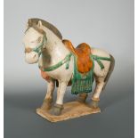 A large Ming Dynasty Sancai glazed horse, finely moulded and glazed, the unusually large mingqi in