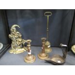 A brass Mr. Punch doorstop, 11in high, another doorstop, a pair of candlesticks and two old