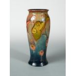 A rare Moorcroft flambé fish vase, circa 1930, painted in colours under a flambé glaze, painted