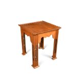 An Art Nouveau style teak occasional table, the square top with scalloped gallery above a shaped