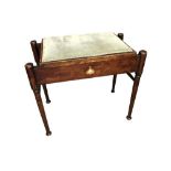 A Glasgow School stained beech piano stool, the hinged padded seat with storage below. With mother-