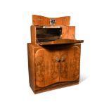 A Rivington Art Deco style walnut cocktail cabinet, the rise and fall top opening to reveal a fitted