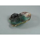 A modern Daum pate de verre glass ashtray, modelled as a frog upon a lily pad, etched mark to