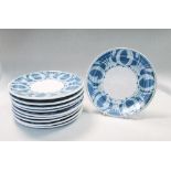 Alan Caiger-Smith (British, born 1930), a set of ten dinner plates, painted in blue with wax resist,