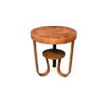 An Art Deco bentwood occasional table, the circular top on three bent U-shaped supports united by an