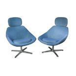 A pair of Danish mid-century blue cloth upholstered swivel lounge chairs, raised on X-form chrome