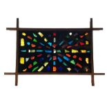 A 1970s abstract acrylic panel, the rectangular panel set with multi-coloured acrylic shards