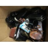 A collection of cameras including Zenit-E, Vest pocket Kodak, binoculars etc