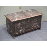 A small later 19th century carved oak coffer chest, 36 x 68 x 34cm