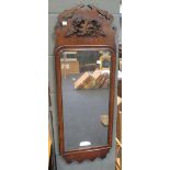 A Georgian style fret carved walnut frame hanging mirror, having applied gilt leaf motif (damaged)