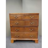 A George III mahogany chest of drawers in two halves, on bracket feet, 119 x 108 x 54cm