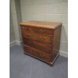 A Georgian oak chest of three long and two short drawers with brass bail handles on bracket feet,