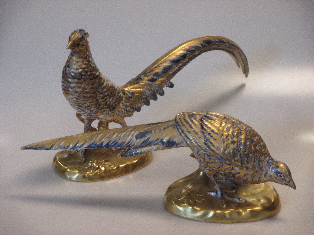 A pair of Portugese porcelain grazing pheasants (2)