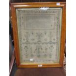 A 19th century sampler, in maple frame, dated 1823 (faded) 43 x 31.5cm