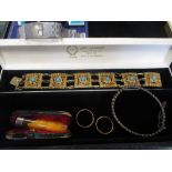 Two 22ct gold wedding rings 12.4g gross, together with a boxed Tissot watch, a boxed amber and