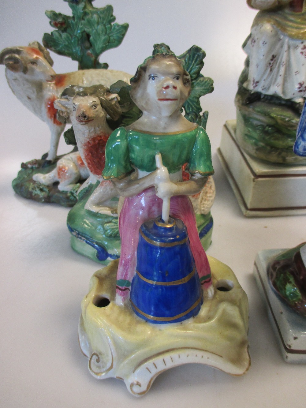 A small pearlware figure of a seated lady together with a quantity of similar figures (8) - Image 4 of 5