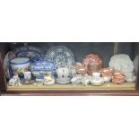 A shelf of mixed china, including a teaset, French pottery, blue and white tureen, etc