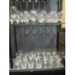 A large collection of brandy glasses of varying sizes together with other drinking glasses