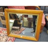 A rectangular maple veneered and parcel gilt wall mirror, 74 x 84cm