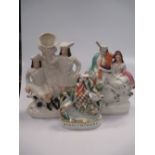A large collection of Staffordshire figures including 'Burns & Mary', 'Napoleon', and two pairs of