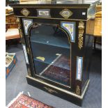 A Victorian ebonised china cabinet with porcelain floral mounts, 112 x 85 x 34.5cm