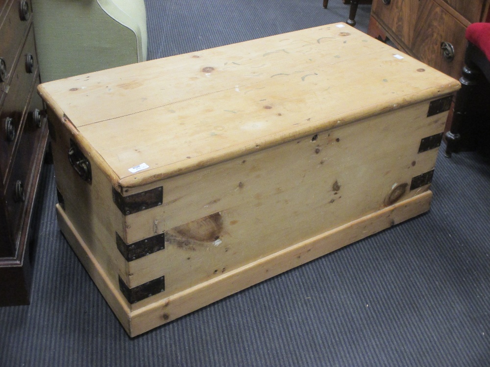 A small stripped pine blanket box with hinged lid and metalwork accents, 40 x 90 x 44cm together